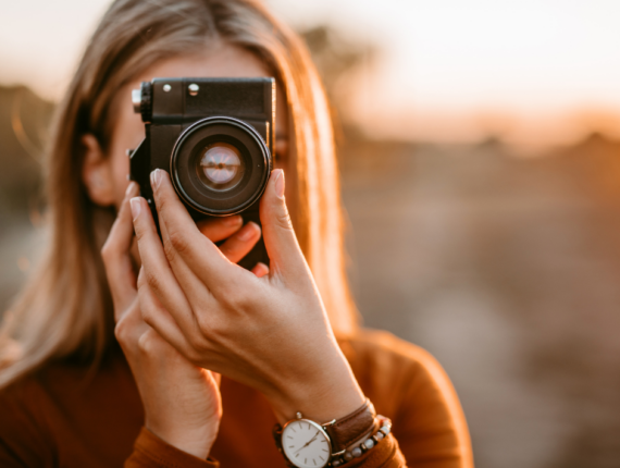 Wedding Photographer holding up a camera